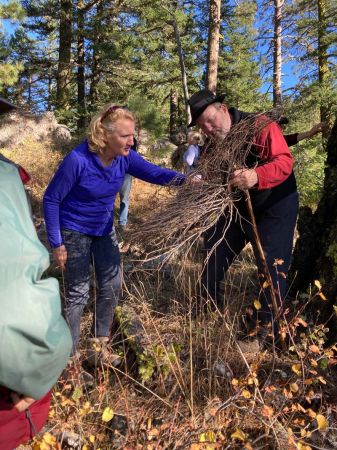 volunteer teaches about fire ecology during hike and learn event